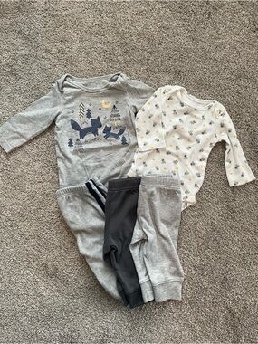 Two long sleeve onesies with 3 matching pants.
